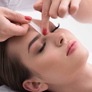 Woman Getting Eyebrows Waxed